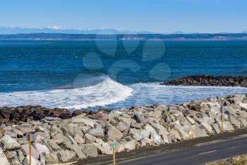Waves roll onto the rock breakwater in Westport, Washington.
