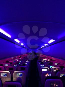 Airplane interior horizontal with people and pink
