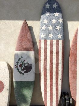 Surfboards with American and Mexico flag at beach sunny day sport background