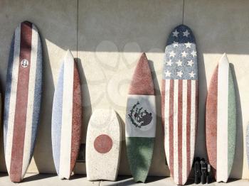 Surfboards with American and Mexico Japan flag at beach sunny day sport background