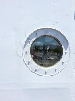 Porthole on metal ship with round circle glass on USS Iowa naval warship destroyer battleship