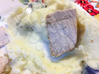 pork mashed potatoes and butter on plate like bangers and mashes