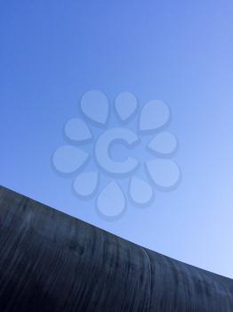 Modern concrete architecture abstract background with blue sky up high