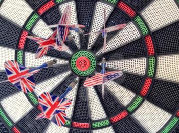 Bullseye darts dartboard with american and britain flag trade political allies concept