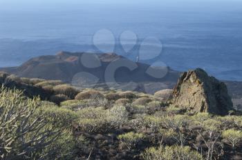 Landscape with the Orchilla lighthouse in the background. Frontera Rural Park. El Pinar. El Hierro. Canary Islands. Spain.