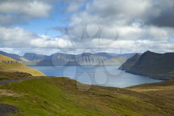 Panoramic view of spectacular Faroese fjords near Funningur as seen from a high mountain next to Slaettaratindur during a sunny autumn day