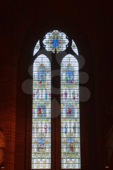 Liverpool, UK - 19 October 2019: Interior of Cathedral Church of Christ showing a stained glass window