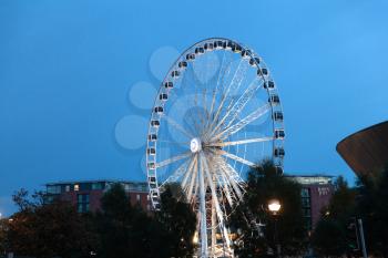 Liverpool, UK - 19 October 2019: Wheel Of Liverpool illuminated at dusk