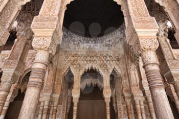 Granada, Spain - 26 July 2013: Detail of arabesques arches in the Alhambra