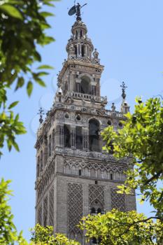 The Giralda is the bell tower of the Seville Cathedral in Seville. It was originally built as a minaret during the Moorish period.
