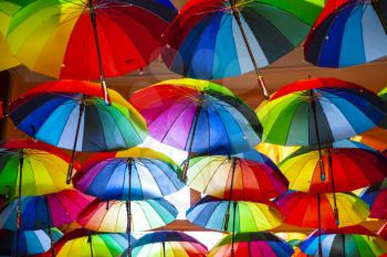 Rainbow gay pride protection symbol in hanging umbrellas