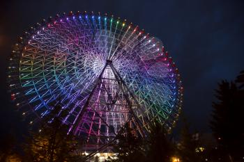 TOKYO-JAPAN, 12 June 2016: Tempozan Ferris Wheel is located in Osaka, Japan. The wheel has a height of 112.5 metres. The wheel has colored lights that provide a weather forecast for the next day. 