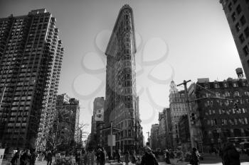 NEW YORK, USA - MARCH 24, 2017: The Flatiron Building is a triangular 22-story steel-framed landmarked building in the borough of Manhattan, New York, is considered to be a groundbreaking skyscraper.