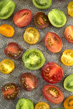 Top view of a various colored organics tomatoes 