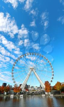 Great wheel of Montreal with his panoramic view 60 of meters high, and a breathtaking view of the river, Old Montreal and downtown city during fall season 